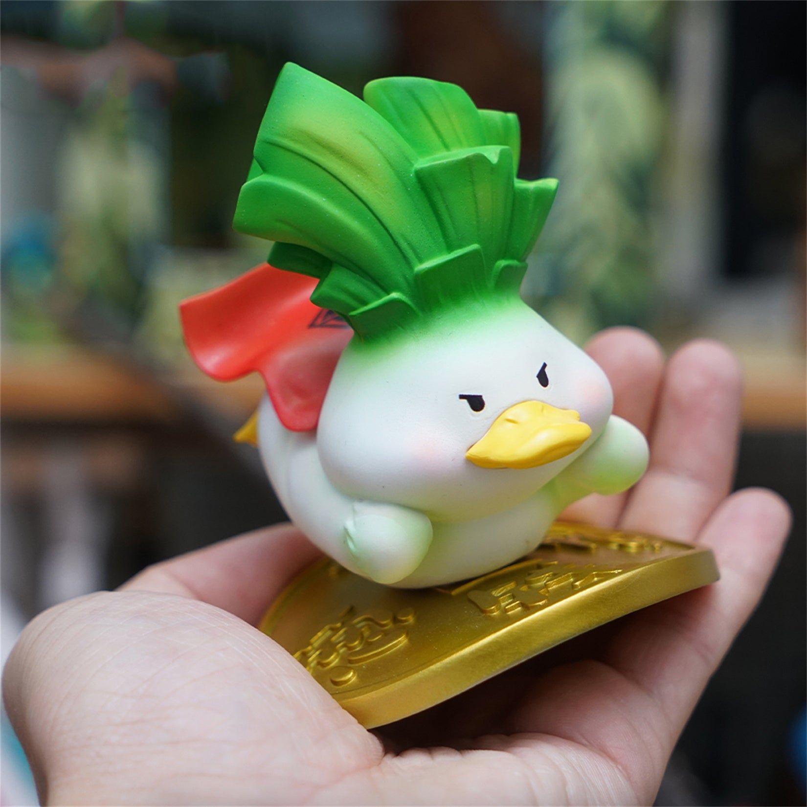 Figurine de canard porte-bonheur en résine