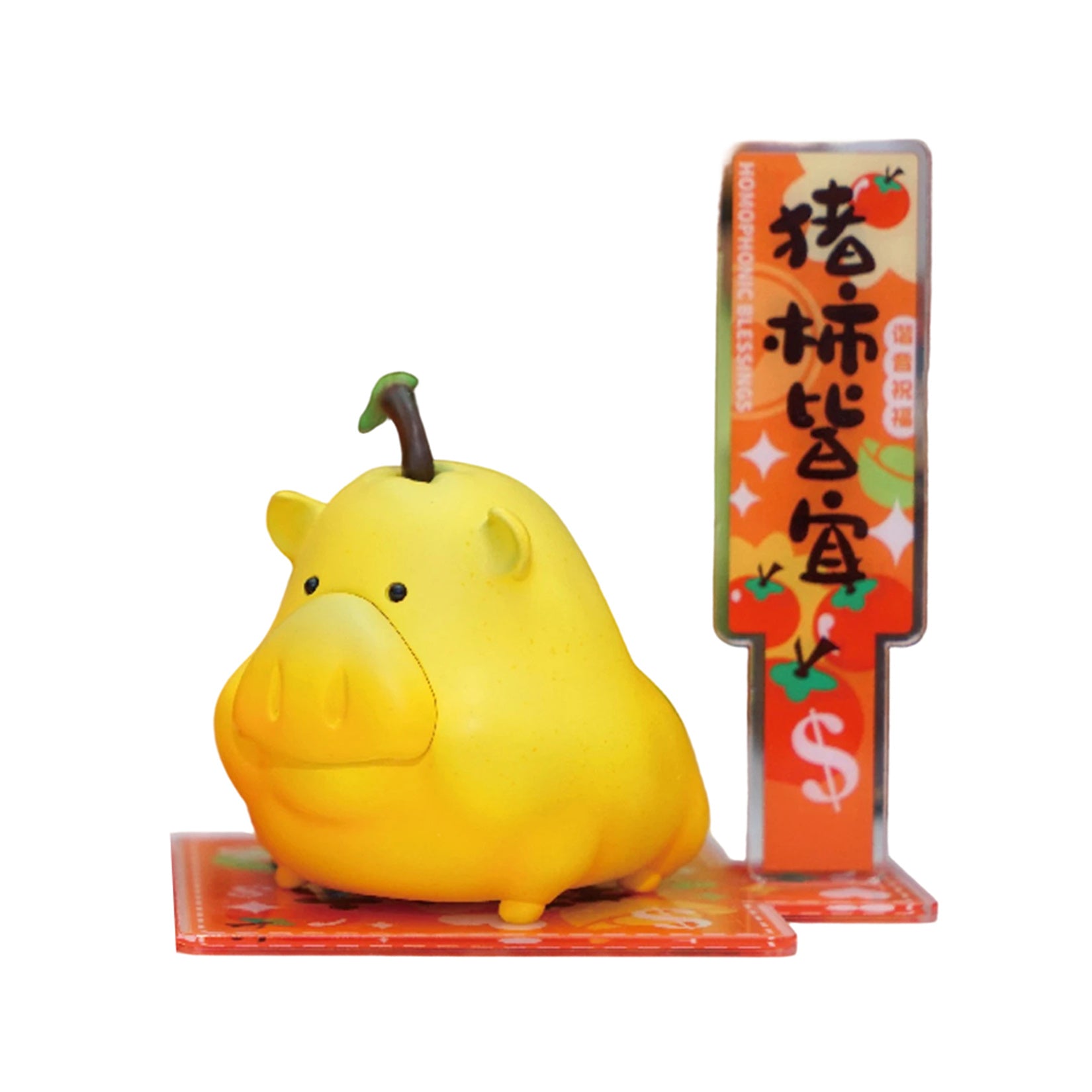 Sculpture en résine représentant un cochon porte-bonheur et des fruits